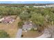 House with a large yard and surrounding trees at 37351 Neighbors Path, Zephyrhills, FL 33542