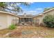 Enclosed backyard with patio and seating area, needs landscaping at 37351 Neighbors Path, Zephyrhills, FL 33542