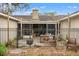 Enclosed patio area with fire pit and some furniture at 37351 Neighbors Path, Zephyrhills, FL 33542