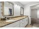 Double vanity bathroom with granite countertop and mirrors at 37351 Neighbors Path, Zephyrhills, FL 33542