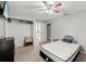 Bedroom with a bed, dresser, and walk-in closet at 37351 Neighbors Path, Zephyrhills, FL 33542