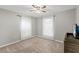 Spacious bedroom with neutral walls and two windows at 37351 Neighbors Path, Zephyrhills, FL 33542