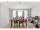 Dining area with bay window and wooden table at 37351 Neighbors Path, Zephyrhills, FL 33542