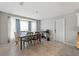 Bright dining room with bay window and seating for six at 37351 Neighbors Path, Zephyrhills, FL 33542