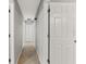 Clean hallway with tile flooring and neutral walls at 37351 Neighbors Path, Zephyrhills, FL 33542
