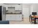 Efficient kitchen with white cabinets and granite countertops at 37351 Neighbors Path, Zephyrhills, FL 33542