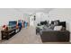 Spacious living room featuring a comfortable sectional sofa and ample space at 37351 Neighbors Path, Zephyrhills, FL 33542