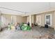 Cluttered screened porch needing some organizing at 37351 Neighbors Path, Zephyrhills, FL 33542