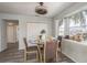 Dining area with glass table and four chairs near a window at 5406 Captains Ct, New Port Richey, FL 34652