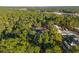 Lush aerial view of a home nestled in a verdant forest, showcasing privacy and natural surroundings at 7376 Fall St, Brooksville, FL 34613