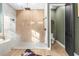 Modern bathroom featuring a luxurious shower with a bench and an adjacent toilet room for added privacy at 7376 Fall St, Brooksville, FL 34613