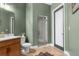 Bathroom featuring modern fixtures, vanity, toilet, and a glass-enclosed shower, creating a serene space at 7376 Fall St, Brooksville, FL 34613