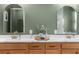 Elegant bathroom with a double sink vanity, decorative mirrors, and modern fixtures offering a spa-like experience at 7376 Fall St, Brooksville, FL 34613