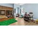 Spacious bedroom with a playful wooden fort bed and laminate wood flooring at 7376 Fall St, Brooksville, FL 34613