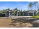 Stunning home exterior with a spacious driveway and a three-car garage, creating a welcoming curb appeal at 7376 Fall St, Brooksville, FL 34613