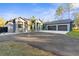 Beautiful home with a long driveway and three-car garage at 7376 Fall St, Brooksville, FL 34613