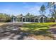 Beautiful home exterior featuring well-maintained landscaping and a spacious driveway at 7376 Fall St, Brooksville, FL 34613