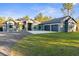 Stunning home with lush green lawn and a three car garage at 7376 Fall St, Brooksville, FL 34613