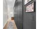 Inviting hallway with decoratively textured wall and elegant runner, leading to additional living spaces at 7376 Fall St, Brooksville, FL 34613