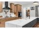 Modern kitchen featuring a marble island, updated cabinets, and stainless steel appliances at 7376 Fall St, Brooksville, FL 34613