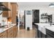 Kitchen leading into a pantry and other rooms, featuring stainless steel appliances and a modern design at 7376 Fall St, Brooksville, FL 34613