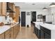Bright and airy kitchen with granite countertops, island sink, and stainless appliances at 7376 Fall St, Brooksville, FL 34613
