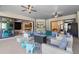 Cozy covered patio with comfortable seating, ceiling fans and access to the interior at 7376 Fall St, Brooksville, FL 34613