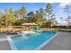 Backyard pool with tanning ledge, umbrella, and fence at 7376 Fall St, Brooksville, FL 34613