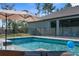 Inviting swimming pool surrounded by lush landscaping, ideal for outdoor enjoyment at 7376 Fall St, Brooksville, FL 34613