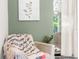 Cozy sitting area accented by a plush chair and serene wall art at 7376 Fall St, Brooksville, FL 34613