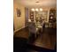 Bright dining room features hardwood floors and a glass-top dining table at 140 Callaway Ave, Spring Hill, FL 34606