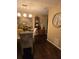 Elegant dining room showcasing a unique wall art piece and hardwood floors at 140 Callaway Ave, Spring Hill, FL 34606