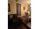 Spacious living room featuring a comfortable sectional sofa and hardwood floors at 140 Callaway Ave, Spring Hill, FL 34606