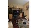 Living room with hardwood floors, large TV, and decorative accents at 140 Callaway Ave, Spring Hill, FL 34606