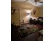Living room features hardwood floors, a comfy couch, and abstract wall art at 140 Callaway Ave, Spring Hill, FL 34606