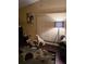 Living room with hardwood floors, floor lamp, and abstract wall art at 140 Callaway Ave, Spring Hill, FL 34606