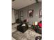 Cozy living room with gray walls, comfy seating, and stylish decor at 140 Callaway Ave, Spring Hill, FL 34606