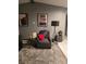 Relaxing living room featuring a recliner and contemporary decor at 140 Callaway Ave, Spring Hill, FL 34606