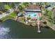 Aerial view showing community pool, clubhouse, and lake at 4808 Vesper Ct, New Port Richey, FL 34655