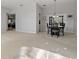 Dining area with table and chairs, view into Gathering room at 591 Waterford W Cir, Tarpon Springs, FL 34688