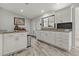 White kitchen with ample counter space and cabinets at 591 Waterford W Cir, Tarpon Springs, FL 34688