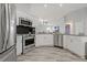 Updated kitchen, stainless steel appliances, white cabinets at 591 Waterford W Cir, Tarpon Springs, FL 34688