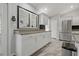 White kitchen cabinets and countertops, stainless steel appliances at 591 Waterford W Cir, Tarpon Springs, FL 34688