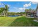 Serene lake view from the backyard at 591 Waterford W Cir, Tarpon Springs, FL 34688
