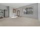 Spacious living room with neutral walls and carpeted floors at 591 Waterford W Cir, Tarpon Springs, FL 34688