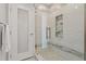 Updated shower with glass enclosure and modern tile at 591 Waterford W Cir, Tarpon Springs, FL 34688