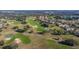 Aerial view of a golf course with residential area at 13235 Legends Trl, Dade City, FL 33525