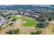 Golf course hole with sand traps and residential homes at 13235 Legends Trl, Dade City, FL 33525