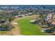 Golf course hole with sand traps and players visible at 13235 Legends Trl, Dade City, FL 33525