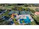 Aerial view of community pool and tennis courts at 13235 Legends Trl, Dade City, FL 33525